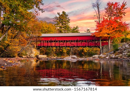 A beautiful red covered bridge in the fall! Royalty-Free Stock Photo #1567167814