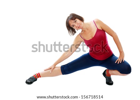 Fitness healthy middle aged woman doing stretching exercise
