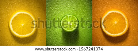 Sliced citrus fruit orange lemon and lime with water droplets creating texture - fresh and healthy food concept image Royalty-Free Stock Photo #1567241074