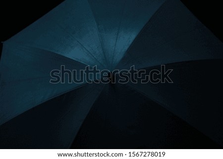 Umbrella in a dark room