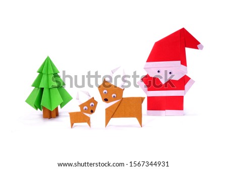 Origami Christmas paper art, Santa Claus, reindeer and Christmas tree for greeting season of Christmas and New year. Copy space
