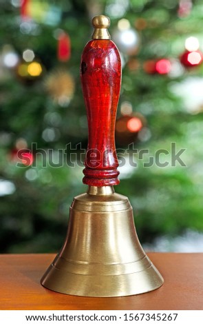Traditional christmas handbell with tinsel