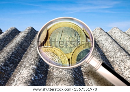 How much does it cost to remove asbestos? - Concept image with magnifying glass and euro symbol.