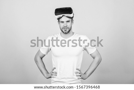 VR for gaming. Man play game in VR glasses. Man hipster with virtual reality headset on peach background. Explore cyber space. Entertainment and education. Virtual communication. Virtual simulation.