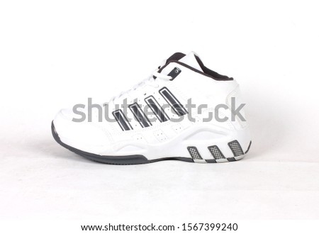 white and black basket ball shoes isolated