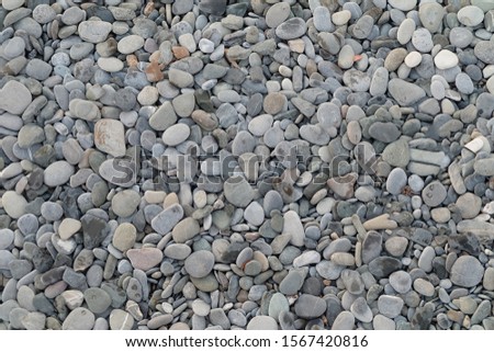Background of pebbles from the sea beach.