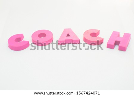 `COACH` words with letters on a white background 