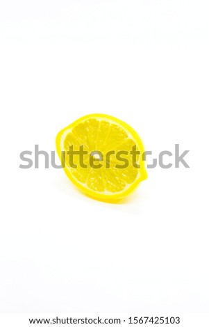 yellow plastic lemonade toy in front of plain white background
