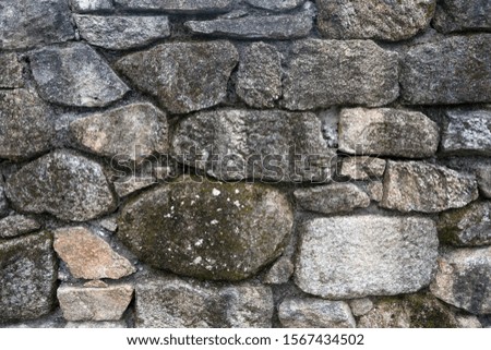 Texture of a stone wall. Old castle stone wall background. Wall made of wild stone. Natural background