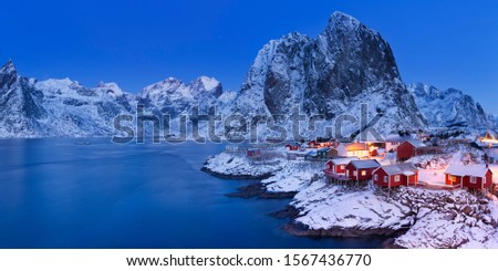 Traditional Norwegian fisherman's cabins, rorbuer, on the island of Hamnøy, Reine on the Lofoten in northern Norway. Photographed at dawn in winter.