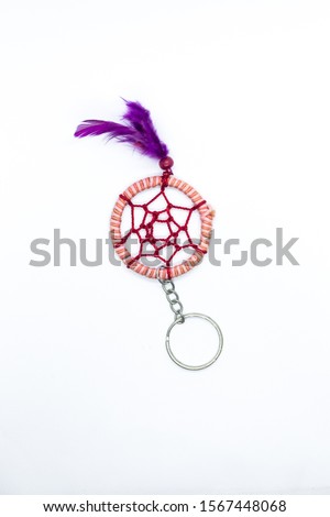 Peace sign key chain in front of plain white background