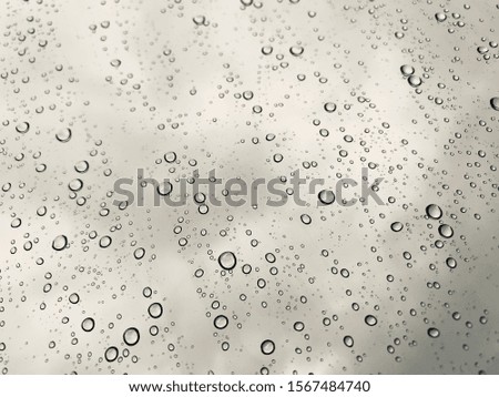 Rain droplet on glass surface 