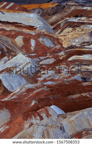 Mining waste dump on the coal surface mine. Beautiful colors of mining waste.