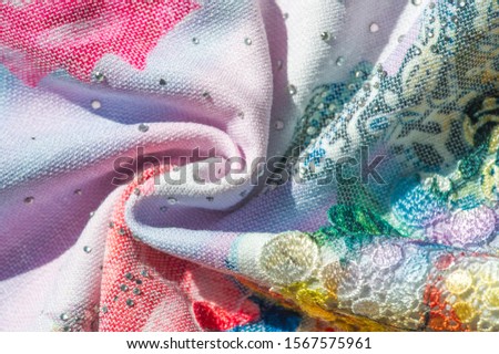 background texture; pattern. Cloth with glued lace stripes. Multicolored lace with sparkles; cording and metallic embroidery. Beautiful traditional lace for design