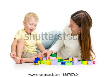 child and his mom play together with block toy