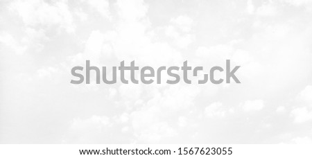 White background of sky and soft white clouds in blur tone.