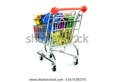 4 Wheel trolley shopping cart filled with variety color of gift boxes on isolated white background