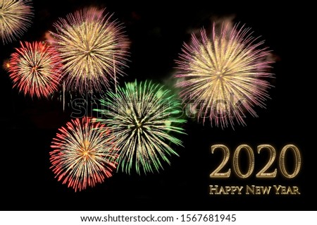 New year 2020 greeting card with gold letters Happy new year 2020 and flashes of festive fireworks salute on a black background