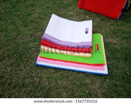 Multicolored d cut ECO Friendly Bags, Non Woven Bags on Green Grass