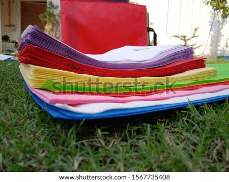 isolated ECO Friendly Bags, Non Woven Bags on Green Grass