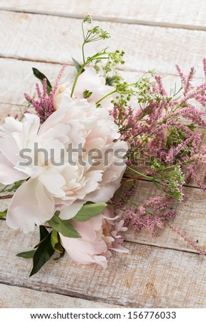 Postcard with fresh flowers of peony. Selective focus.