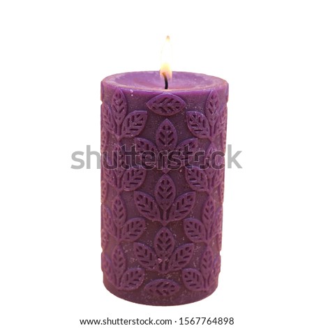 A purple carved lavender candle that relaxes isolate object on a white background-Image
