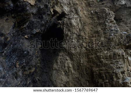 cave in a black rock mountain.