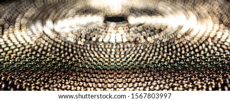 Panoramic view of a golden plate macro with shallow depth of field for a bokeh effect
