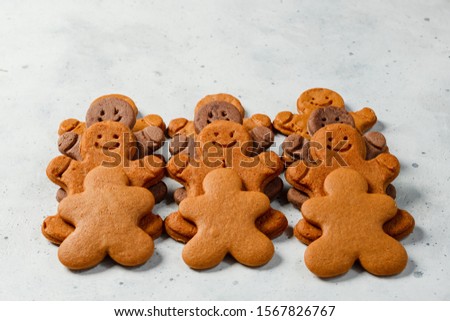 Collection of various gingerbread men in rows