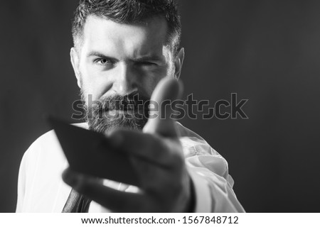Business man presenting creditcard. Shopping and spending. Credit card as secure online payment. Handsome man with blank business card in hand. Businessman showing credit card or empty visiting card.