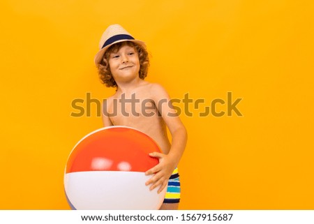 guy in swimming pools with a swimming ball