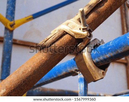 Closeup locking clamp pipe Metal locks for fixing the structural pillars to be strong on the construction site.