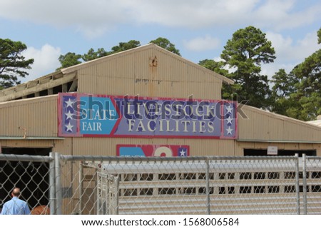 Old Livestock Auction Barn With Peeling Paint on Sign