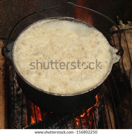 The picture shows a pot on the fire. In a pot that is boiling and then boil.