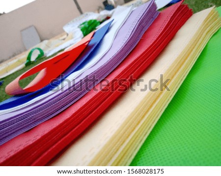 isolated Friendly colored Bags, Non Woven Bags on Green Grass