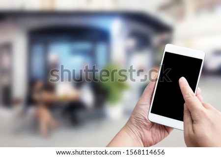 Food delivery service for order online shopping concept on touch screen of smatphone on woman hand service express that is cooked by restaurant. Business and technology with lifestyle in city.