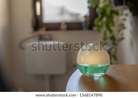 Fragrance ball on a toilet