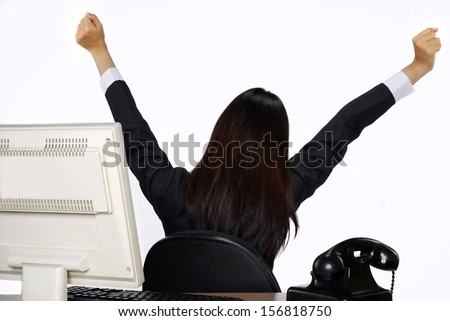 Successful business woman with computer isolated over a white background