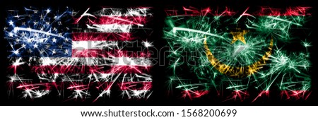 United States of America, USA vs Mauritania, Mauritanian New Year celebration sparkling fireworks flags concept background. Combination of two abstract states flags.
