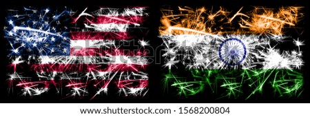 United States of America, USA vs India, Indian New Year celebration sparkling fireworks flags concept background. Combination of two abstract states flags.
