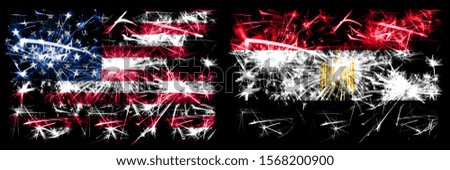 United States of America, USA vs Egypt, Egyptian New Year celebration sparkling fireworks flags concept background. Combination of two abstract states flags.
