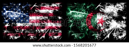 United States of America, USA vs Algeria, Algerian New Year celebration sparkling fireworks flags concept background. Combination of two abstract states flags.
