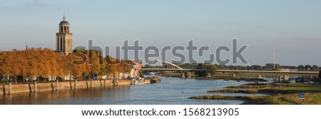 A panoramic view on the city of Deventer in the Netherlands and the river Ijssel in autumn