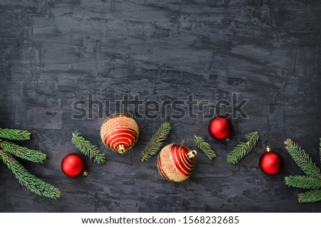 Red Christmas balls on dark background. Copy space composition. Christmas and New year concept. Overhead shots