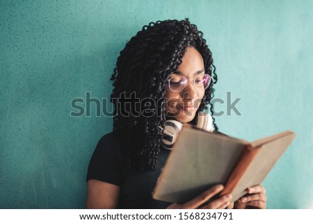 beautiful young woman reads a book