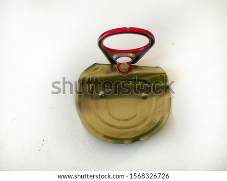 Lid of an open tin can  Isolated on a white background.