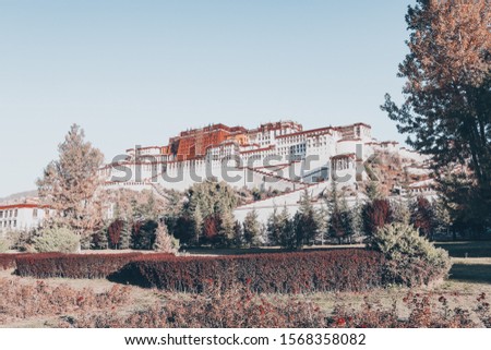 Photo from side of the sacred Potala palace in Lhasa, Tibet China. Potala palace used to be the residency of Dalai lama and is now a museum and World Heritage Site of Tibet Autonomous Region