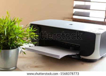 Close up of an office table with printer on it