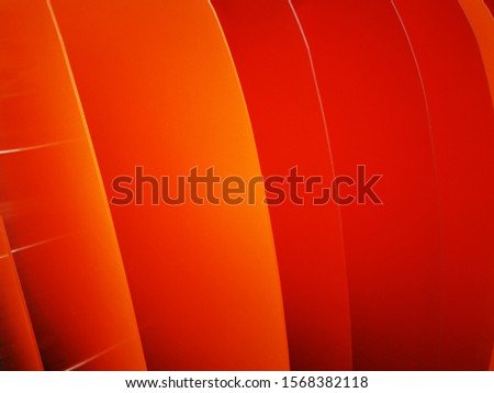 Bright wavy pattern with 3d effect. Photo of plastic panels. Dynamic style. Orange- Red background.Colorful wavy background. Geometric texture. Bright wavy background. Flyer backdrop.