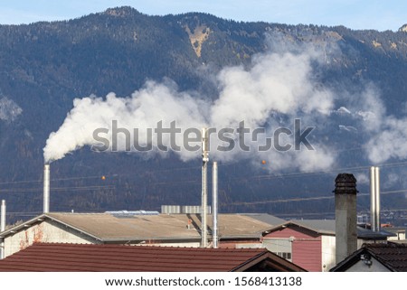 Factory with chimney and a lot of CO2 emissions